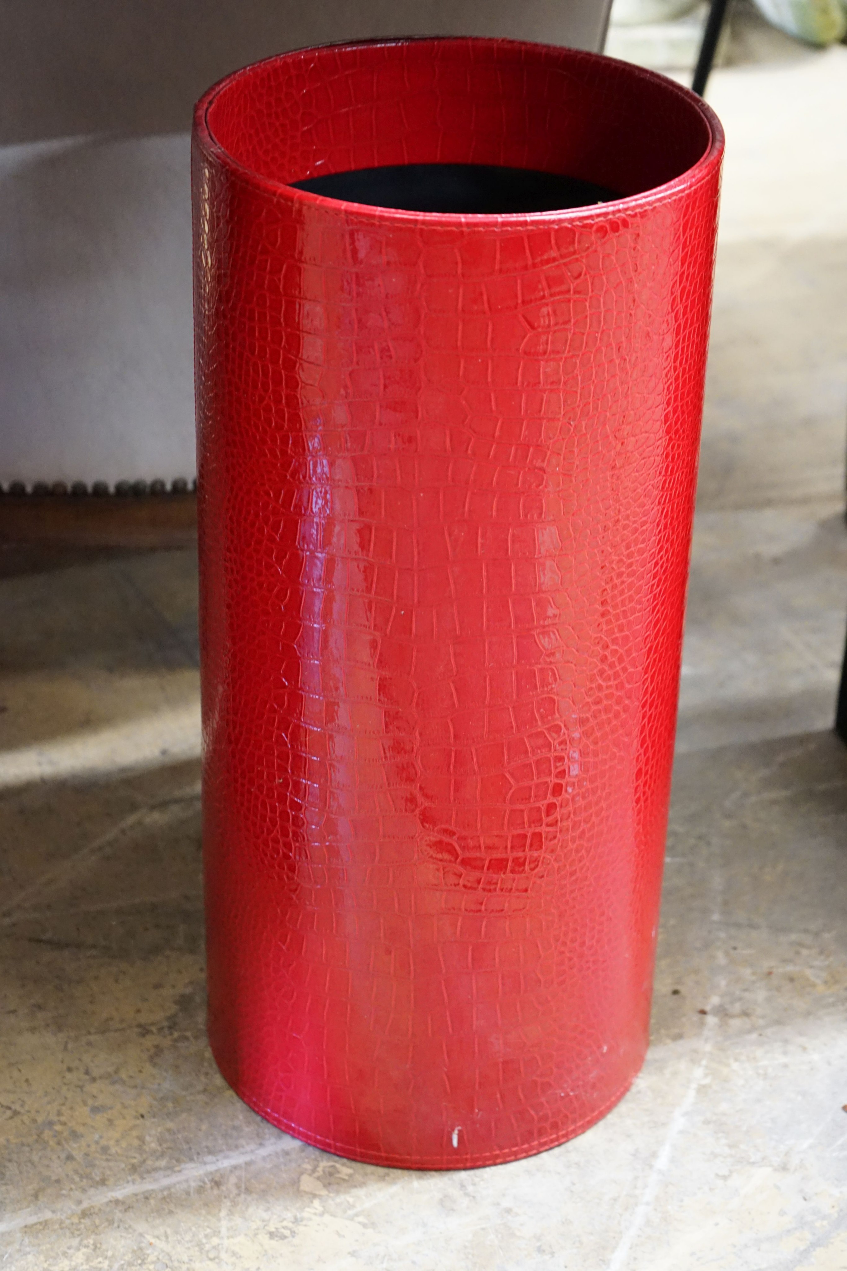 A contemporary red faux crocodile console table, width 80cm, depth 32cm, height 70cm and a stick stand